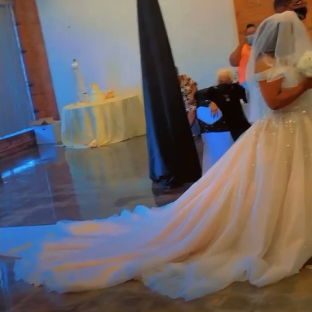 I am selling my wedding dress size 20.